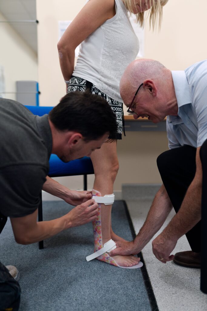 Photo: older woman being fitted with an orthotic