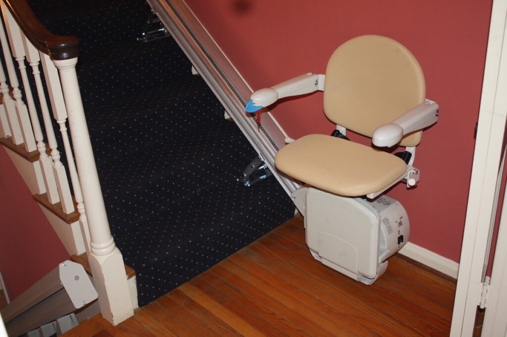 Photo: Stair lift for limited mobility installed by Accessibility Remodeling
