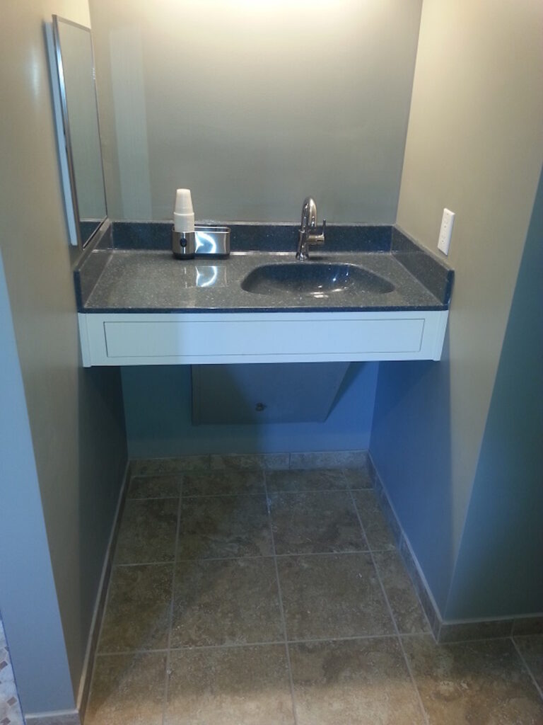 Photo: Vanity with space for chair underneath by Accessibility Remodeling
