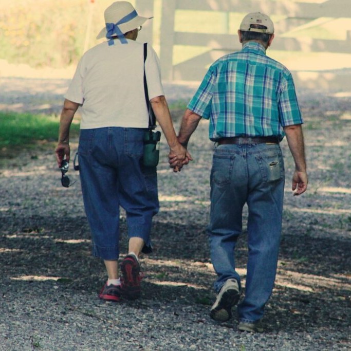 Photo: Older Couple holding hands